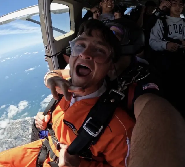 Friend skydiving and yelling with excitement